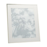 Silverplated rectangular photo frame with slim polished silver edge and white mount border for a 10 x 8in print, shown angled on a plain white background.