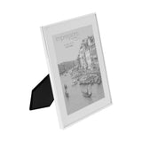 Silverplated photo frame with slim silver edge and white mount, rectangular 10 x 8in opening, shown at an angle with stand on a plain white background.