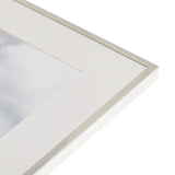 Close-up of the Silverplated Photo Frame 10 x 8in corner, showing the slim polished silver edge and white mount against a plain white background.