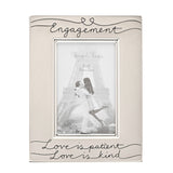 Satin silverplated rectangular engagement photo frame with "Engagement" script and heart detail at top, "Love is patient, Love is kind" at bottom, holding a 6 x 4in sample photo.