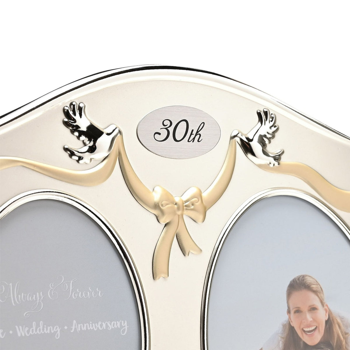 30th Anniversary double photo frame in silverplated finish, arched design with gold ribbon bow, silver doves, and "30th" plaque between two oval photo openings.