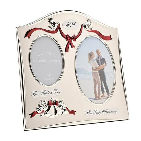 Silverplated double photo frame with arched top, oval openings for Our Wedding Day and Our Ruby Anniversary, silver doves, red ribbon swag, 40th plaque and wedding bells detail.