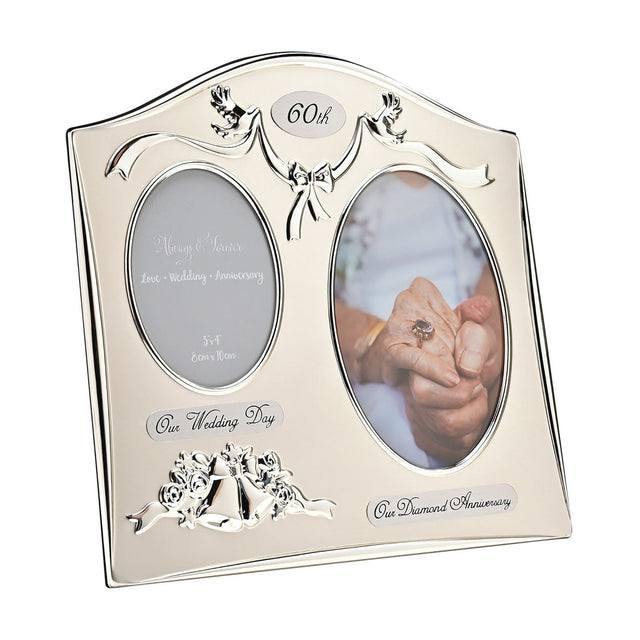 Silverplated double photo frame with arched top, dove and ribbon motif, "60th" plaque, wedding bells detail, and oval openings for 3x4in photos on a white background.