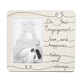 Silver-plated 6x4in photo frame with rectangular opening, featuring "On Your Engagement, love and happiness, today and always" in black script with heart motifs on a white background.