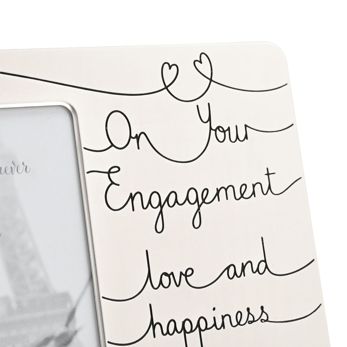 Silver-toned 6x4in photo frame with rectangular photo opening, featuring "On Your Engagement love and happiness" in black script with heart details on a looping thread design.
