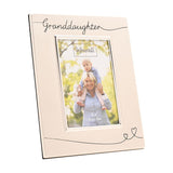 Rectangular silverplated "Granddaughter" photo frame in satin silver, with script lettering and heart-tipped line details, holding a 4x6in photo on a white background.