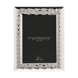 Rectangular silverplated metal photo frame with a faceted, patterned wide border, holding a 5 x 7in black sample insert on a plain white background.