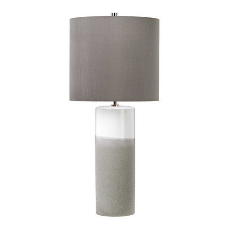 The Fulwell 1 Light Table Lamp blends a cylindrical, dual-tone ceramic base of white gloss and matte gray, complemented by a large, round gray fabric lampshade. Its simple yet stylish design makes it an elegant piece of contemporary lighting.