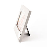 Side view of the grey wooden Grandchildren photo frame with heart 6 x 4in, showing its easel stand and depth against a plain white background.