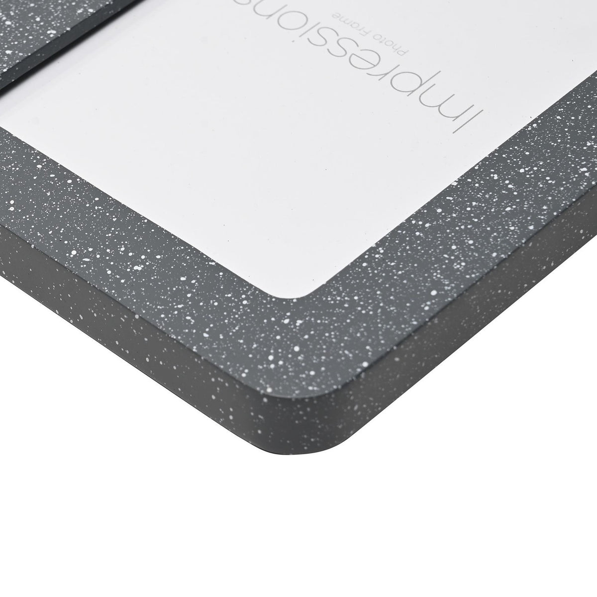 Close-up of the Speckled Rounded Wooden Photo Frame 7 x 5in corner, showing a grey speckled border with fine white flecks and rounded edge against a white background.