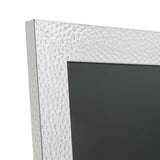 Close-up of a rectangular photo frame corner in silver plastic with a hammered effect finish, showing the mitred edge and dark insert against a white background.
