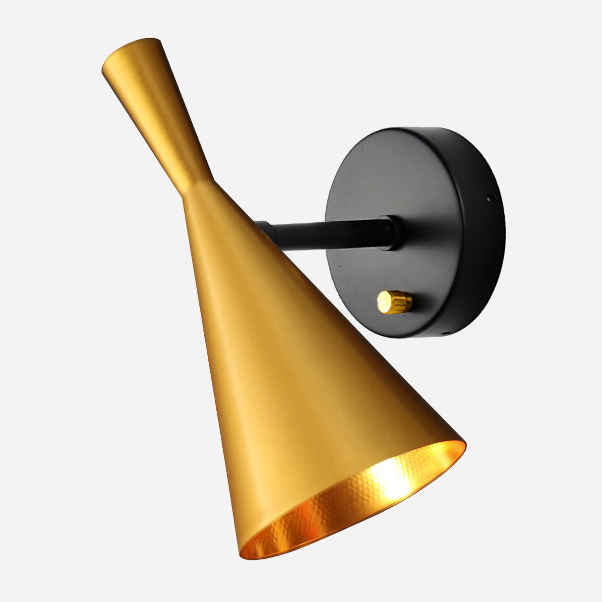 The Funk Wall Light - Gold is a contemporary wall-mounted sconce with a matte black circular base and an elongated, cone-shaped golden shade that casts a warm glow. Its sleek design effortlessly integrates minimalist aesthetics with elegant home decor.