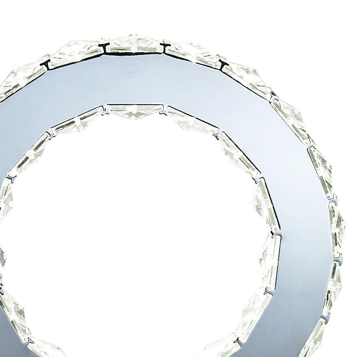 Close-up of the Galaxy LED Crystal Round Table Lamp 10W 6000K in polished chrome, featuring clear faceted segments around the edge and a reflective metallic surface, set against a white background.