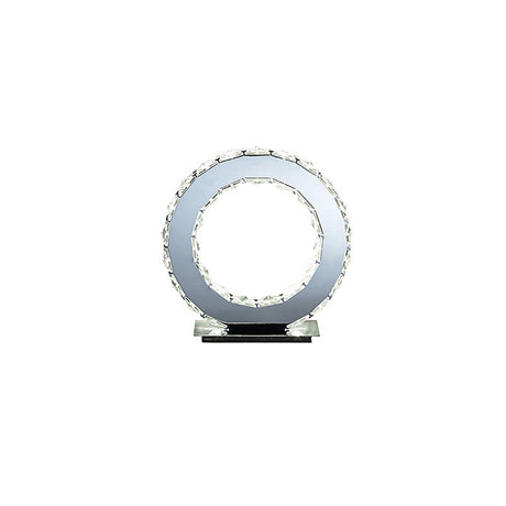 The Galaxy LED Crystal Round Table Lamp 10W 6000K in Polished Chrome features a modern circular crystal design with a hollow center, set on a rectangular black base, and displayed on a white background.