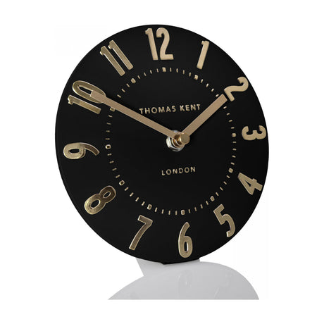 Gallery Direct Mulvorne 6 inch mantel clock with a round matt black dial, raised gold 3D Arabic numerals and slim brass hands.