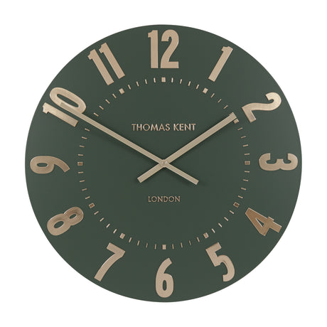 Gallery Direct Mulvorne Wall Clock by Thomas Kent in olive green with raised gold-tone Arabic numerals, slim baton hands and a London-signed matt dial.
