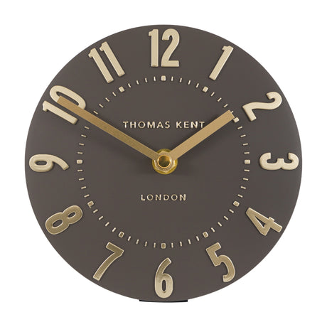Gallery Direct Mulvorne 6 inch mantel clock with a round mocha dial, raised gold Arabic numerals and slim brass hands on a white background.