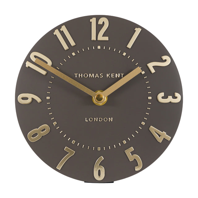 Gallery Direct Mulvorne 6 inch mantel clock with a round mocha dial, raised gold Arabic numerals and slim brass hands on a white background.