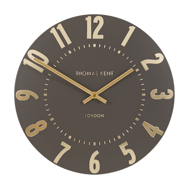 Gallery Direct Mulvorne Wall Clock by Thomas Kent in mocha with raised gold Arabic numerals and slim baton hands on a matt painted dial.