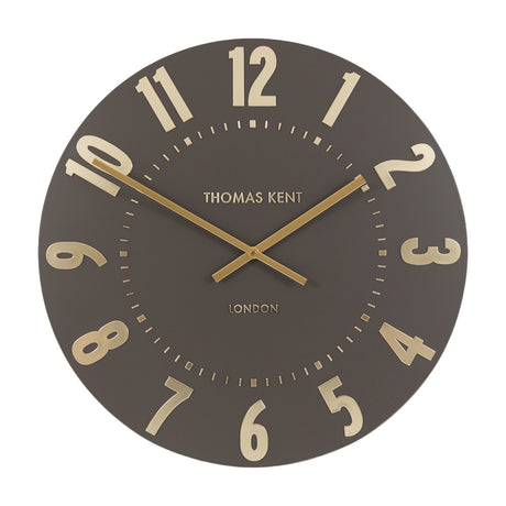 Gallery Direct Mulvorne Wall Clock by Thomas Kent in mocha with raised gold Arabic numerals and slim baton hands on a matt painted dial.