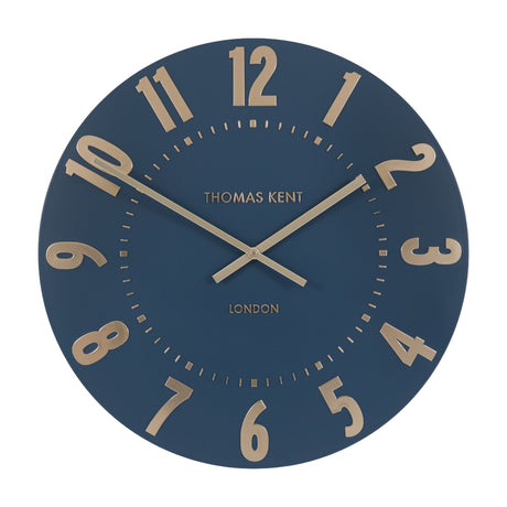Mulvorne Wall Clock by Gallery Direct, a round Thomas Kent analogue clock with a midnight blue matt dial and raised gold-tone Arabic numerals.