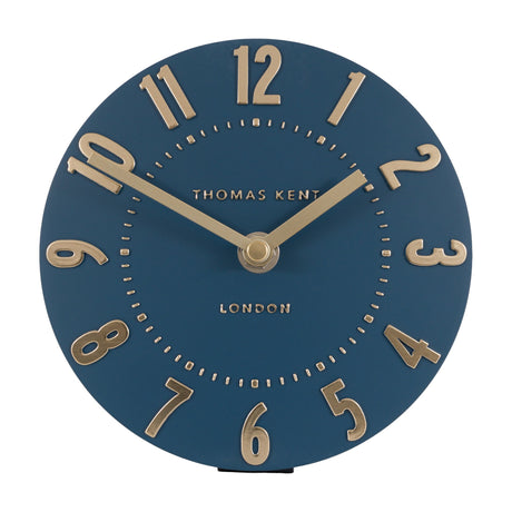 Gallery Direct Mulvorne 6 inch mantel clock in midnight blue with raised gold Arabic numerals and slim hands, Thomas Kent London dial on a white background.