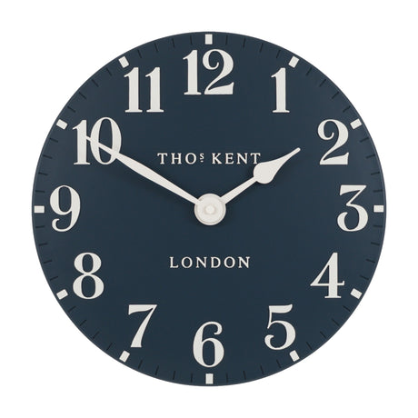 Thomas Kent London Arabic round wall clock in ink navy with cream serif numerals, minute markers and tapered hands on a plain white background.