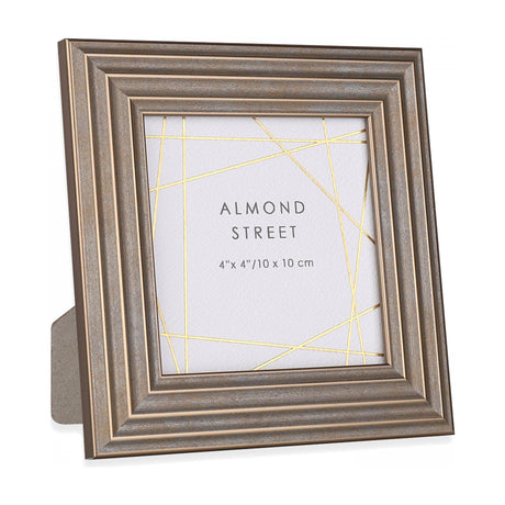 Gallery Direct Hutvorne square photo frame in bronze with stepped moulded ridges, fold-out strut, holding a 4x4in insert, on a white background.