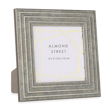 Gallery Direct Burvorne 4x4in photo frame in stone grey with stepped moulded border and cream line detail, shown freestanding on a white background.