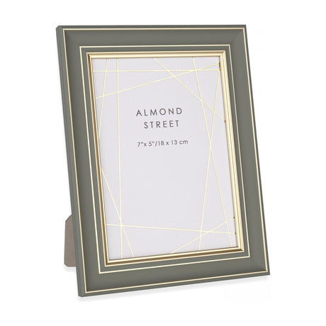 Gallery Direct Ripvane sage photo frame with gold inner trim and stepped profile, fold-out strut back for a 7x5in print, on a white background.