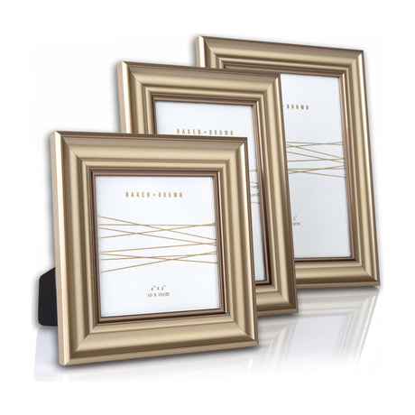 Gallery Direct Kendvane Photo Frame Set of 3 in champagne finish, three moulded rectangular frames with wide sloped profiles on a white background.