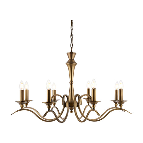 Gallery Direct Kelsenna 8-light chandelier in antique brass with curved arms, candle-style holders and chain suspension on a white background.