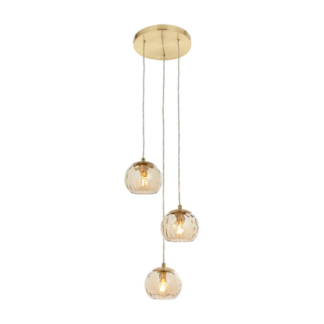 Gallery Direct Ilvaris 3-light cluster pendant with staggered dimpled amber glass globes on clear cables and a satin brass ceiling plate.