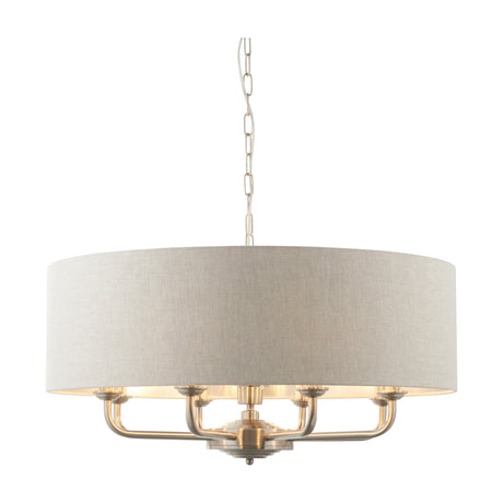 Gallery Direct Clervorne 8 Light Pendant with natural linen drum shade, brushed metal arms and chain suspension on a white background.