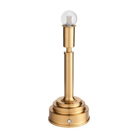 Gallery Direct Upvael rechargeable table lamp in brushed aged brass with a slim stem, tiered stepped base, push button, and clear LED globe bulb.