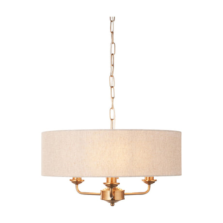 Gallery Direct Clervorne 3 light pendant with natural linen drum shade and vintage brass frame on chain suspension.