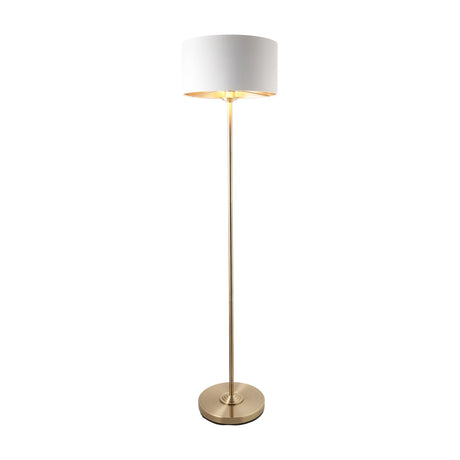 Gallery Direct Clervorne Floor Lamp in antique brass with slim stem, weighted circular base and natural linen drum shade on a plain white background.
