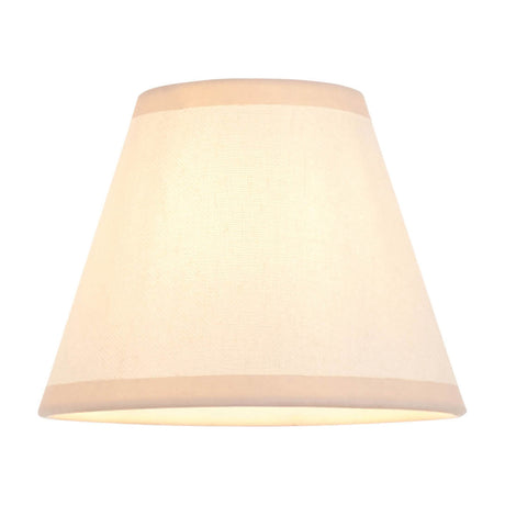 Gallery Direct Ivrenne tapered fabric lamp shade in almond white, shown illuminated against a plain white background.