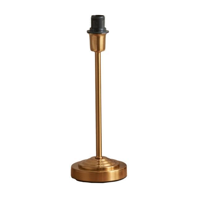 Gallery Direct Riselle Table Lamp Base in vintage brass steel with a slim stem, stepped round foot and screw-fit bulb holder, shown on a white background.