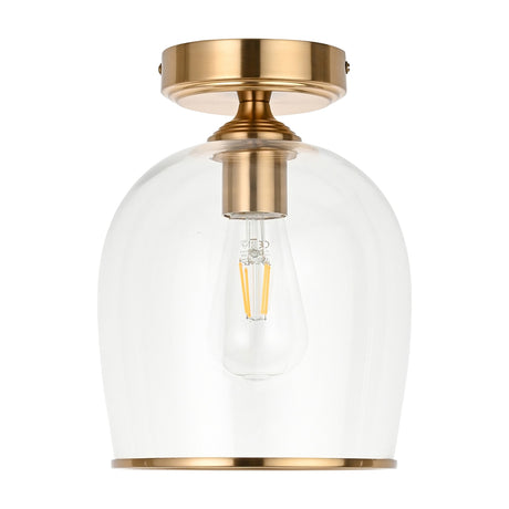 Gallery Direct Vellamis semi-flush ceiling light with aged brass fitting and clear glass dome shade housing an E27 filament bulb, on white.