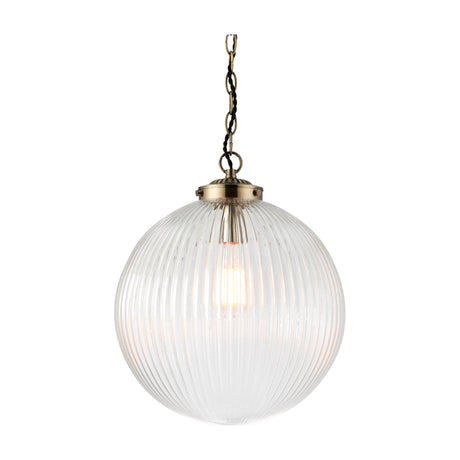 Gallery Direct Braylis ribbed clear glass globe pendant light with antique brass fitting and chain suspension on a white background.