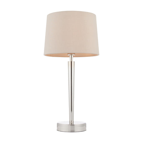 Gallery Direct Syvelle table lamp with tapered mink fabric shade and slim bright nickel stem on a round weighted base, shown on a white background.