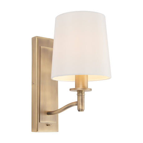 Gallery Direct Ormessa antique brass wall light with rectangular backplate, curved arm and white tapered fabric shade on a plain background.