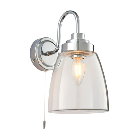 Gallery Direct Ashvenna bathroom wall light in polished chrome with swan-neck arm, clear bell-shaped glass shade, E14 candle bulb and pull cord switch.