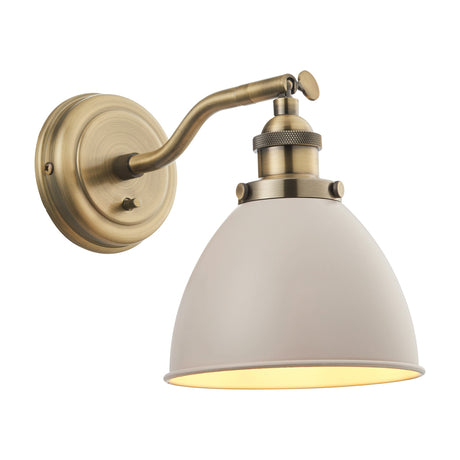 Gallery Direct Fravien Wall Light with domed taupe steel shade, adjustable arm and knurled antique brass fitting on a round backplate.