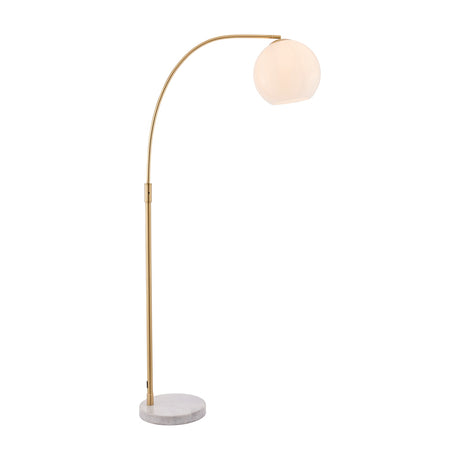 Gallery Direct Otvenna arc floor lamp with antique brass stem, opal white glass globe shade and round white marble base on a plain background.
