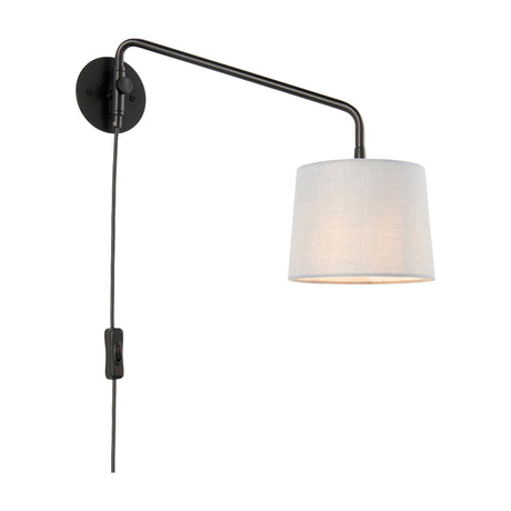 Gallery Direct Carvenne swing arm wall light with matte black steel frame, tapered grey fabric drum shade, and inline switch on the plug-in cord.