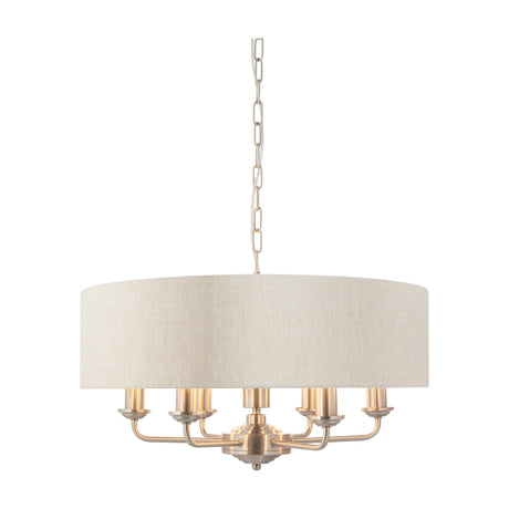 Gallery Direct Clervorne 6-light pendant with brushed chrome arms, central hub, and natural linen drum shade, suspended on chain against a white background.