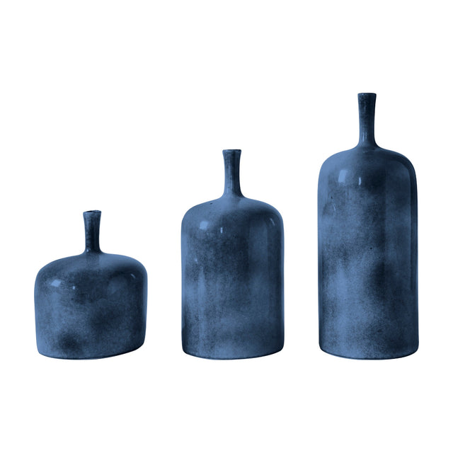 Gallery Direct Vorvane set of 3 blue ceramic bottle vases in graduated heights with glossy tops and speckled bases on a white background.