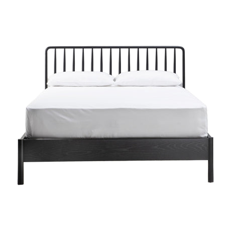 Gallery Direct Wycvorne Spindle Bed in black, king size, with slim turned spindle headboard, low wooden footboard, and white bedding on a plain background.
